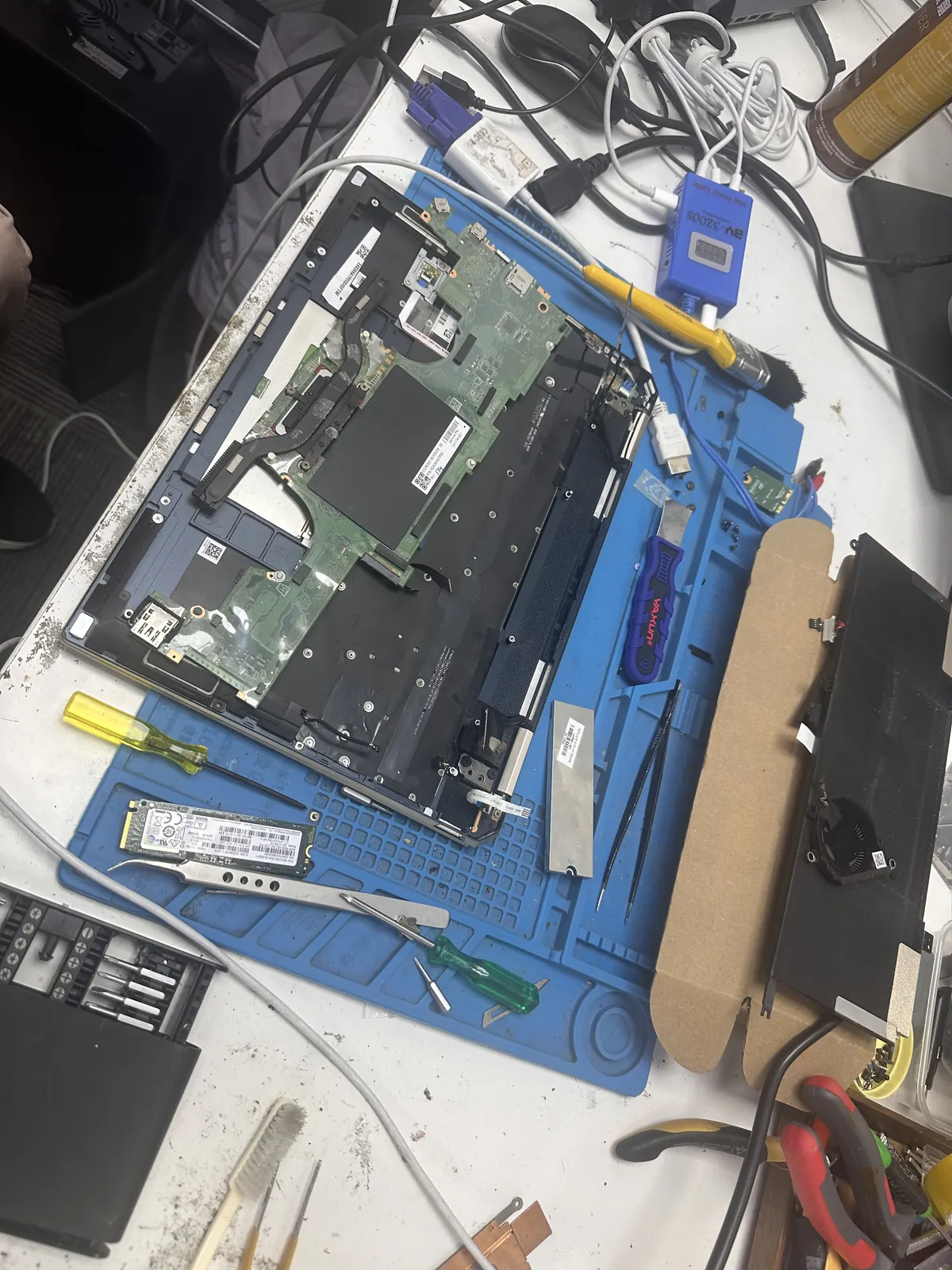 Laptop internals laid out on an anti-static mat